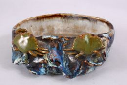 A JAPANESE STUDIO POTTERY CRAB BRUSH WASHER, with a flambeau style glaze, with two crabs climbing
