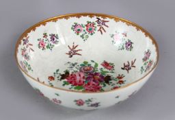 A FINE 18TH CENTURY QIANLONG FAMILLE ROSE PORCELAIN BOWL, decorated with raised monochrome