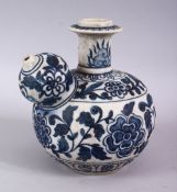 A CHINESE MING STYLE BLUE & WHITE PORCELAIN EWER, with formal scrolling lotus decoration, 19cm