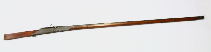 A VERY LONG 19TH CENTURY INDIAN MATCH LOCK / WALL RIFLE, with an certificate signed by maharaj of