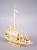 A FINELY CARVED 19TH CENTURY INDIAN IVORY BOAT WITH FISHERMEN, with fine strands of sails, six
