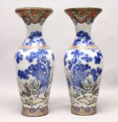 A LARGE PAIR OF JAPANESE MEIJI PERIOD BLUE AND WHITE PORCELAIN IMARI VASES, the body of the vases