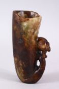 A 20TH CENTURY CHINESE CARVED HARDSTONE LIBATION CUP, carved with the head of a phoenix, 14cm