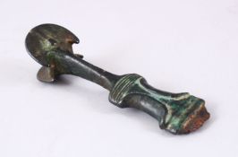 A FINE EARLY PERSIAN BRONZE DAGGER HANDLE, in the form of a twin axe, 14cm