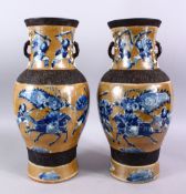 A PAIR OF 19TH CENTURY CHINESE BISCUIT & UNDERGLAZE BLUE PORCELAIN WARRIOR VASES, Decorated with