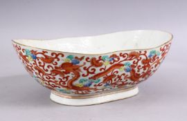 A 19TH CENTURY CHINESE IRON RED PORCELAIN DRAGON BOWL, the body decorated with scenes of dragons and