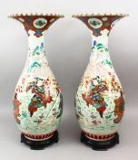 A LARGE PAIR OF JAPANESE MEIJI PERIOD FLARED TOP PORCELAIN KUTANI WARRIOR VASES, each of the vases