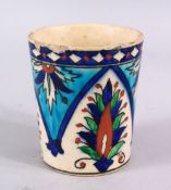 A GOOD TURKISH POTTERY BEAKER, decorated with panel floral design, the base with marks, 10cm.