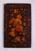 A GOOD 19TH CENTURY PERSIAN LACQUER PAINTED BOOK COVER, depicting native floral spray, 20cm x 12cm