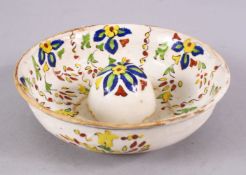 A TURKISH KATAHYA POTTERY LEMON SQUEEZE, WITH BANDS OF FLORAL MOTIF, 16cm diameter.