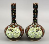 A PAIR OF JAPANESE MEIJI PERIOD BOTTLE SHAPED CLOISONNE VASES, with panel decoration of birds and