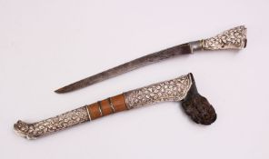 A GOOD ISLAMIC SILVER MOULDED DAGGER, the dagger with silver embossed sheath and hilt, with carved