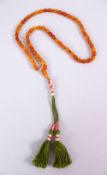 A FINE SET OF CHINESE QING DYNASTY CARVED AMBER BEAD NECKLACE / ROSARY BEADS, comprising 65 carved