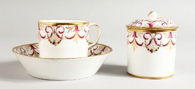 AN EARLY 19TH CENTURY PARIS PORCELAIN COFFEE CAN AND STAND painted and gilded with puce and gold