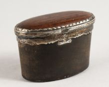 A GEORGE III OVAL HORN AND SILVER SNUFF BOX. 3ins long x 2ins high.