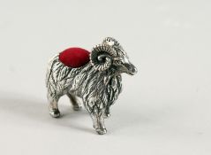 A NOVELTY SILVER RAM PIN CUSHION.