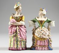 A RARE PAIR OF ANTIQUE MINTON CANDLE SNUFFERS of Mrs Malaprop and Lady Teazle. 3.5ins and 3.75ins