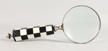 A MAGNIFYING GLASS.