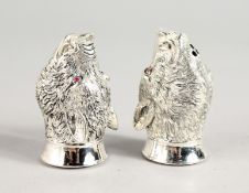 A PAIR OF .800 BOAR'S HEAD SALT AND PEPPERS.