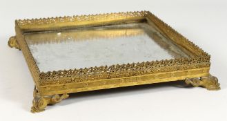 A GOOD 19TH CENTURY FRENCH SQUARE TABLE PLATEAU, with mirrored bottom, gilt mounts and dolphin feet.