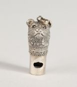 A SILVER NOVELTY BEAR WHISTLE.