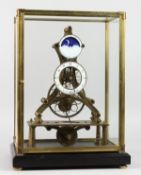 A GOOD, MODERN SKELETON CLOCK WITH MOON PHASE MOVEMENT, in a glass display case. 17.5ins high.