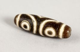 A GOLD INLAID HARD STONE ZHI BEAD.