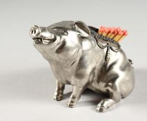 A RUSSIAN SILVER MATCH HOLDER, modelled as a seated pig, inset with small diamonds. 5ins long.