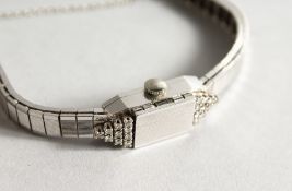 LA FEMME, A LADIES' 14CT WHITE GOLD AND DIAMOND COCKTAIL WATCH, with hinged cover.