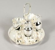 A SILVER PLATED DOUBLE EGG CRUET with chicken salt and pepper.