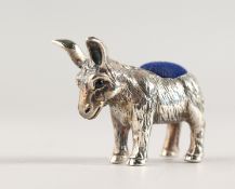 A NOVELTY SILVER DONKEY PIN CUSHION.