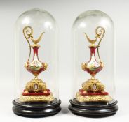 A MIRROR PAIR OF 20TH CENTURY CONTINENTAL PORCELAIN AND ORMOLU EWERS, each painted with a panel