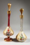 TWO BULBOUS OVERLAY SCENT BOTTLES AND STOPPERS, painted with flowers. 11ins and 9.5ins high.