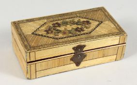 A NAPOLEONIC STRAW WORK BOX AND COVER with floral top. 5.25ins long x 2.75ins wide x 1.75ins deep.