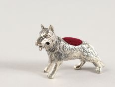 A NOVELTY SILVER DOG PIN CUSHION.