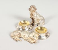 A PAIR OF PLATED DOG AND BOWL SALTS.