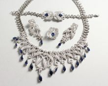A SUPERB HEAVY SILVER FAUX SAPPHIRE FOUR PIECE SET. Necklace, bracelet, earrings and ring.