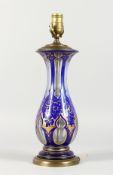 A GOOD BOHEMIAN BLUE AND GILT GLASS LAMP with gilt mounts. 16ins high.