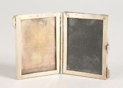 A DOUBLE MINIATURE SILVER PHOTOGRAPH FRAME.