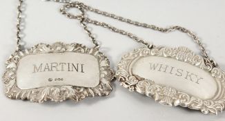 TWO SILVER WINE LABELS.