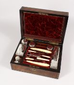 A GOOD VICTORIAN ROSEWOOD BRASS BOUND VANITY CASE, for J. W. McFIE, with three tier fitted interior,
