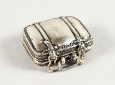 A MINIATURE SILVER SUITCASE.
