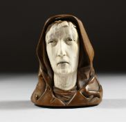 A 19TH-20TH CENTURY EUROPEAN WOOD AND IVORY CARVING, an ivory head with wooden hood. 2.75ins high.