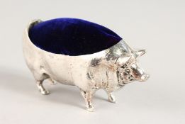 A SILVER PLATED PIG PIN CUSHION. 4.25ins long.