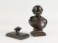 A SMALL BRONZE BUST OF WILLIAM SHAKESPEARE 5ins high and a bronze paperweight (2).