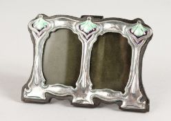 A SMALL ART NOUVEAU STYLE SILVER AND ENAMEL PHOTOGRAPH FRAME. 4.5ins x 3ins.