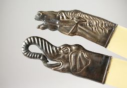 TWO RUSSIAN SILVER HANDLED PAGE TURNERS modelled as an elephant's head and a horse's head. 10ins