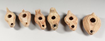 SIX VARIOUS ROMAN TERRACOTTA OIL LAMPS.