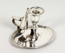A PLATED OVAL CHAMBER STICK AND SNUFFER.