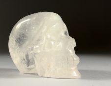 A ROCK CRYSTAL SKULL. 5ins long.
